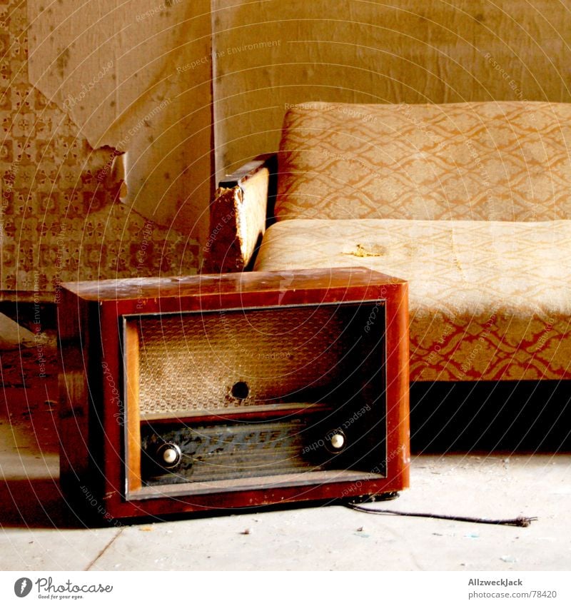 feel-good corner Radio (device) Sofa bed Medium wave Couch East Seventies Wallpaper Scrap Dust Dirty Still Life Untidy wallpaper fragment Old Loneliness grumpy