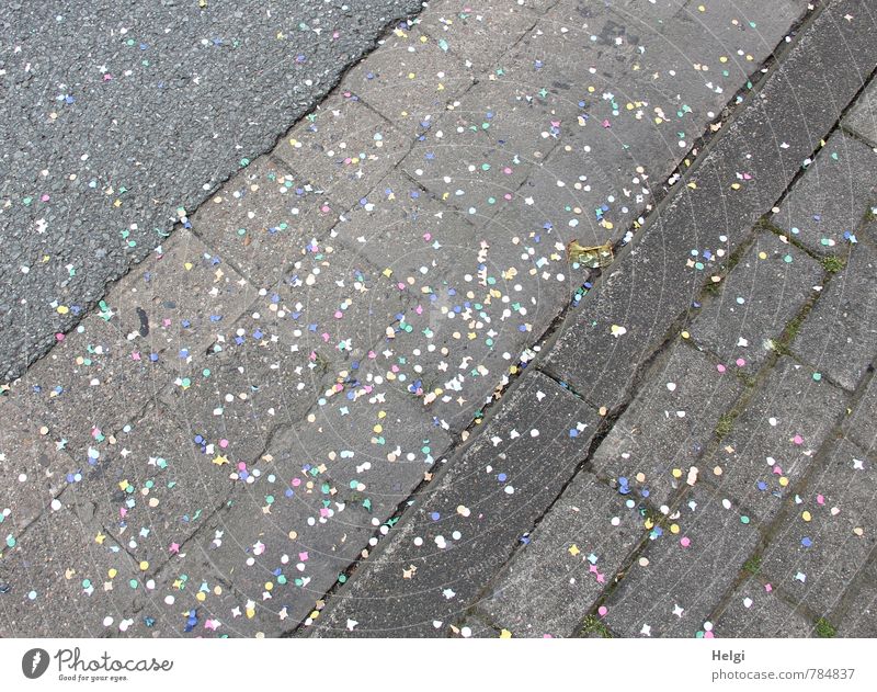 Party is over... Summer Feasts & Celebrations Carnival Traffic infrastructure Street Sidewalk Curbstone Paving stone Pavement Curbside Confetti Lie Authentic