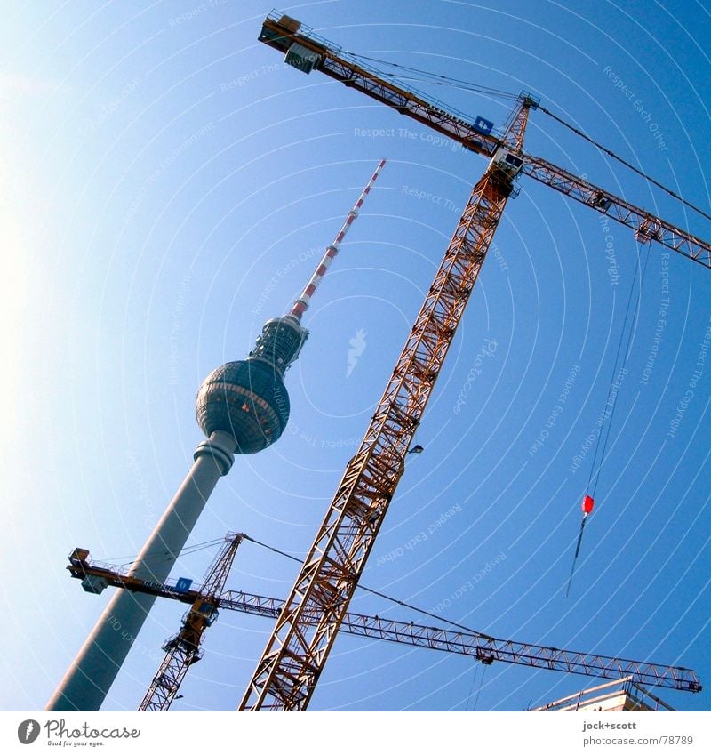 Berlin television tower and crane types Work and employment Construction site Cloudless sky Capital city Manmade structures Architecture Tourist Attraction