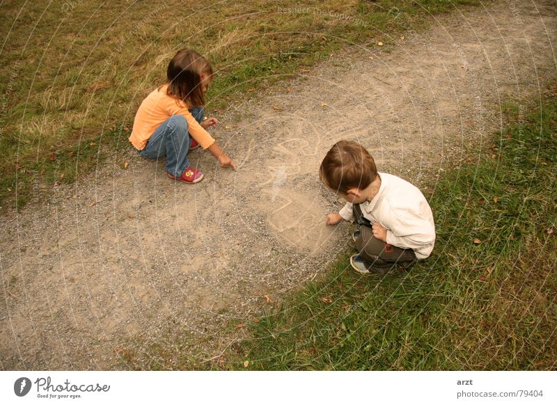 little artists Conceptual design Stone Creativity Girl Child Gravel Grass Dust Crouch Boy (child) Playing Green Pebble Autumn Illustration Drawing Image