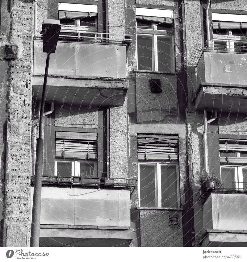 Renewed upturn in restructuring intentions Prenzlauer Berg Facade Balcony Window Retro Gloomy Decline Past Change Lantern Venetian blinds Old building Shabby