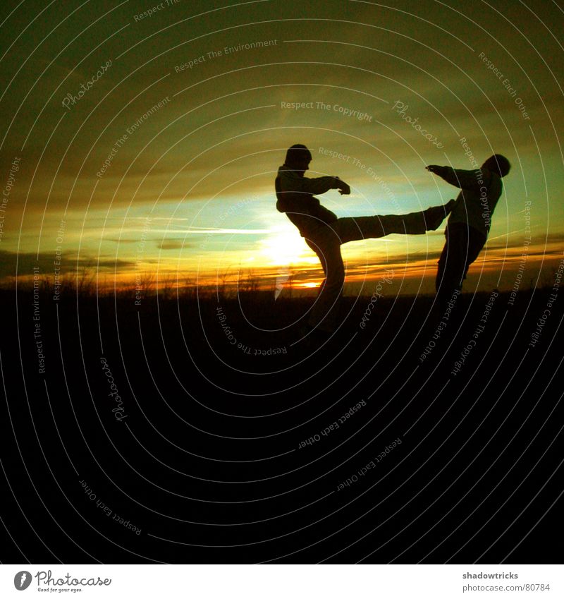 Capoeira - Despite the cold - slide 2 Jump Green Yellow Footstep Tread Fight Clouds Vantage point Panorama (View) Square Sunrise Sunset Back-light Light