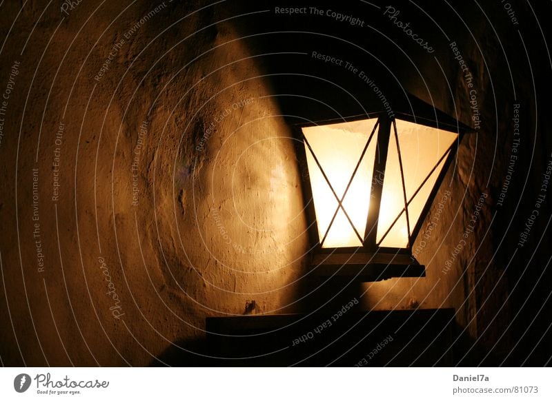 wall lamp Sympathy Structural change Light Glittering Dark Autumn Cozy Wall (building) Lantern Lamp Plaster Morning Well-being Evening Shadowy existence
