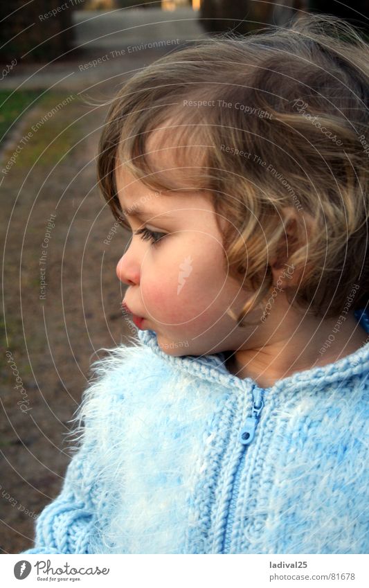 snooze princess Colour photo Exterior shot Evening Profile Looking Downward Child Toddler Mouth Lips Jacket Coat Curl Small Blue Diminutive Child to be baptized
