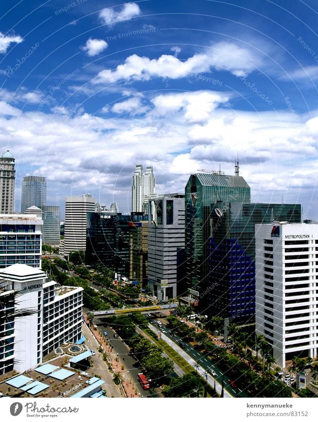 Jakarta's Scrapers Jacarta Town capital city indonesia buildings main road clouds noon office buildings