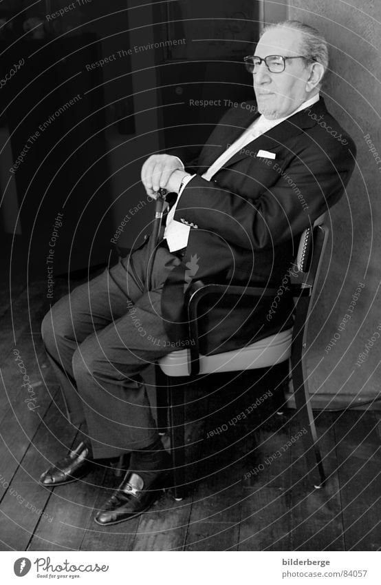Don Vito Black & white photo Portrait photograph Glass Chair Man Adults Nose Mouth Shirt Suit Tie Eyeglasses Sunglasses Footwear Observe Gray Trust Fear