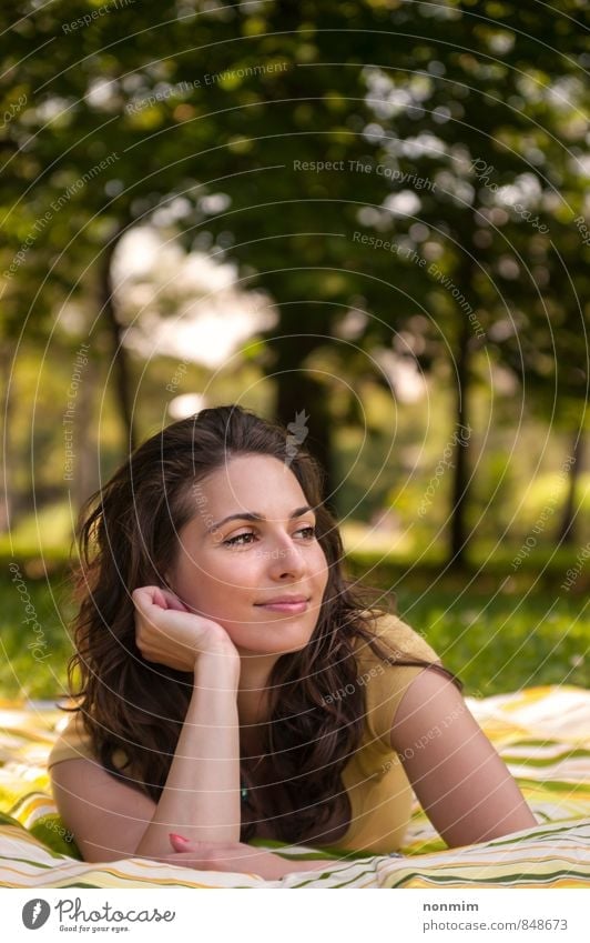 Portrait of a beautiful young woman lying on the grass at park Lifestyle Joy Beautiful Relaxation Woman Adults Youth (Young adults) 18 - 30 years Nature Summer