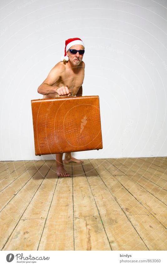 Naked man with sunglasses, Santa cap and an old suitcase in a funny pose Man Adults 1 Human being 30 - 45 years 45 - 60 years Wooden floor Suitcase Sunglasses
