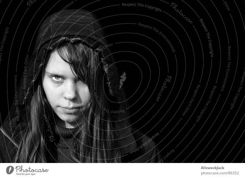 Black is Black 2 Woman Exterior shot Black-haired Freckles Portrait photograph Hooded (clothing) Anorak Long-haired Loneliness Grief Exit route Marginal group