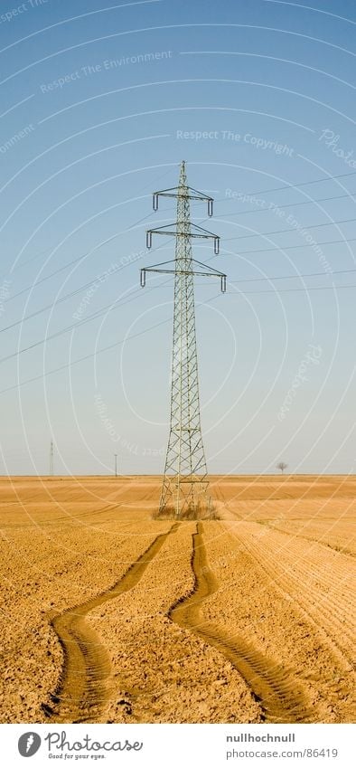 Power pole on the run Arable land Electricity Cable Field Skid marks High voltage power line Tractor track Industry Transmission lines Tracks Beautiful weather