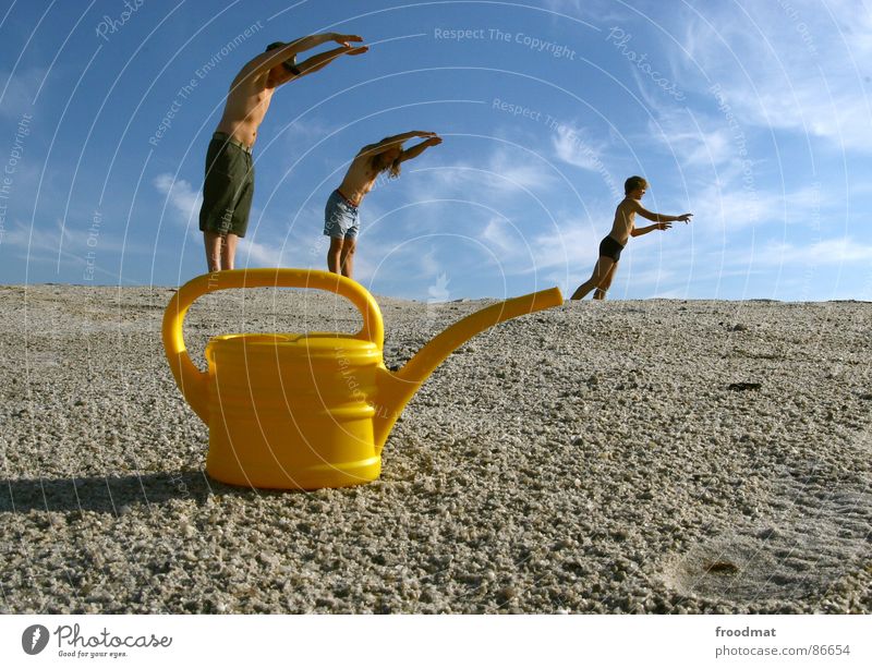 can acrobatics Jug Watering can Yellow Summer Physics Aperture Art Arts and crafts  Mining Sun Warmth Swimming & Bathing Perspective Sky Surrealism Irritation