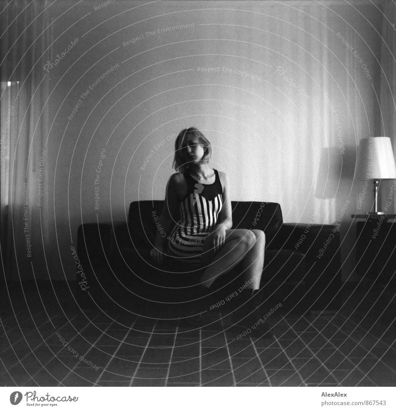 analogue black and white portrait of a young woman in striped dress sitting on a couch Room Young woman Youth (Young adults) Legs 18 - 30 years Adults Punk