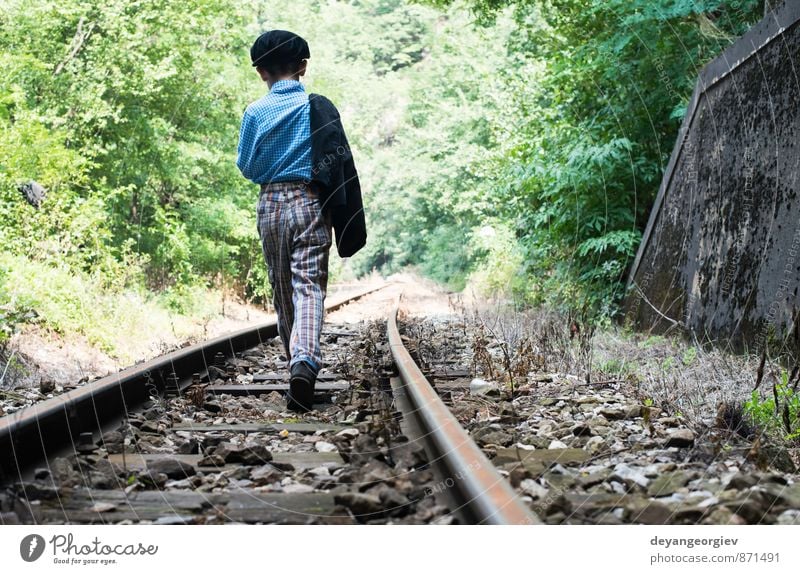 Child walking on railway Vacation & Travel Human being Boy (child) Infancy Nature Railroad Small Cute Loneliness people kid away track young Caucasian Rural