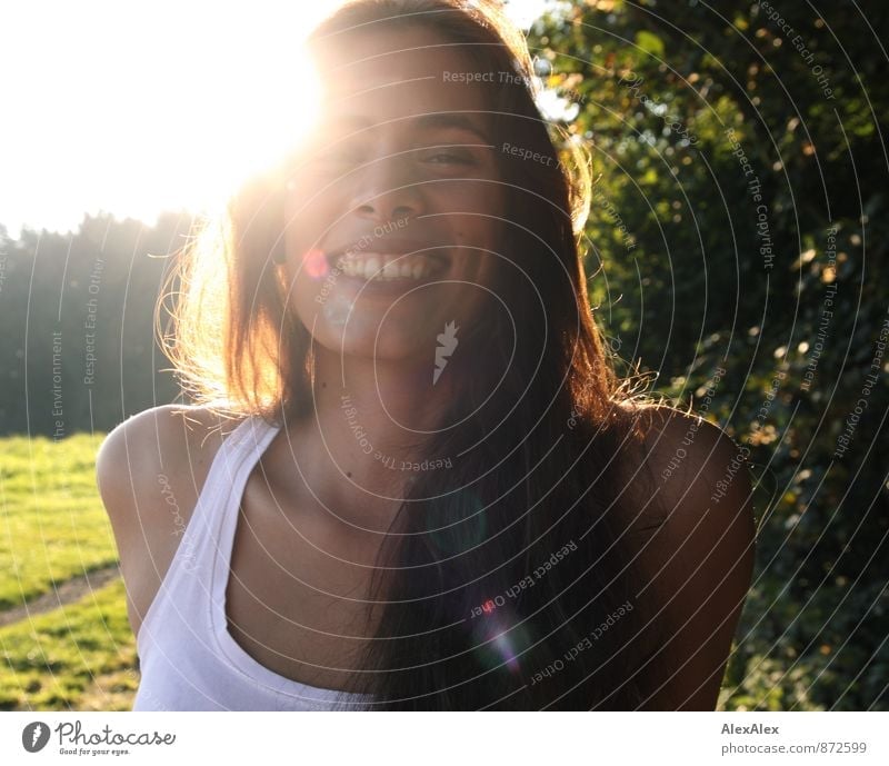 Young beautiful woman laughing with dimples backlit Trip Adventure Summer vacation Young woman Youth (Young adults) Face 18 - 30 years Adults Nature Sun
