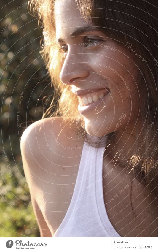 sunny, lateral backlight portrait of a young, beautiful woman with dimples laughing Trip Young woman Youth (Young adults) Face pit 18 - 30 years Adults