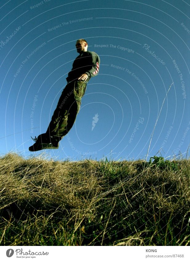 wind misalignment Supine position Jump Horizon Meadow Sky blue Diagonal Speed Green Hop Tilt Grass Joy Man Playing falling like a bird Flying flight fly