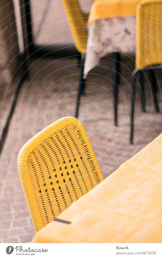 closing time Chair Table Wait Yellow Calm Tablecloth Restaurant Terrace Paving stone Closing time Colour photo Exterior shot Deserted Shallow depth of field