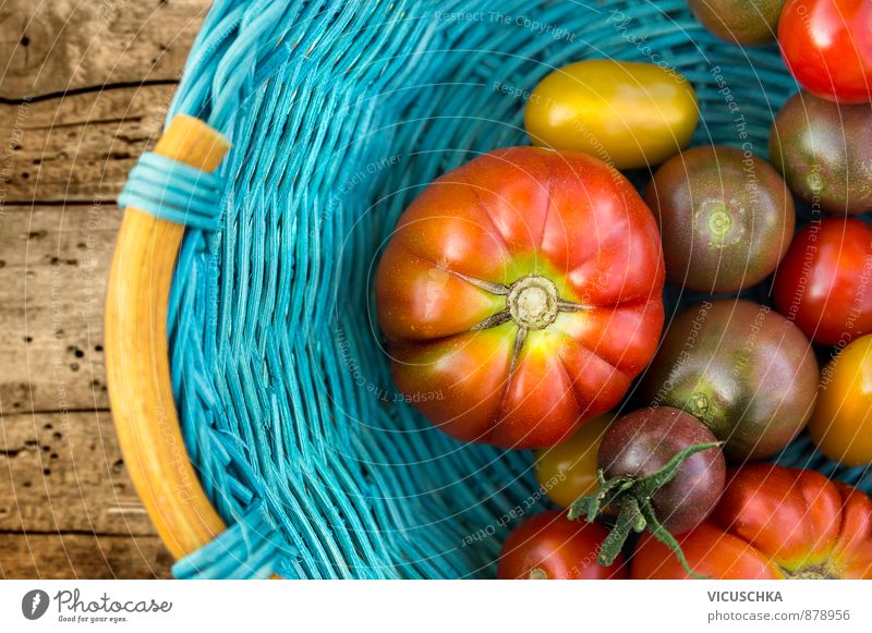 Ripe tomatoes of different varieties in blue basket on wooden table Lifestyle Summer Garden Nature Autumn Plant Blue Yellow Red Leisure and hobbies