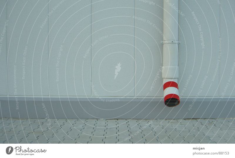 Tube with red on wall in grey Wall (building) Drainage Wall (barrier) Gray Red Stripe Circle Reddish white White Under Flow Grating Mucus Mud Water pipe