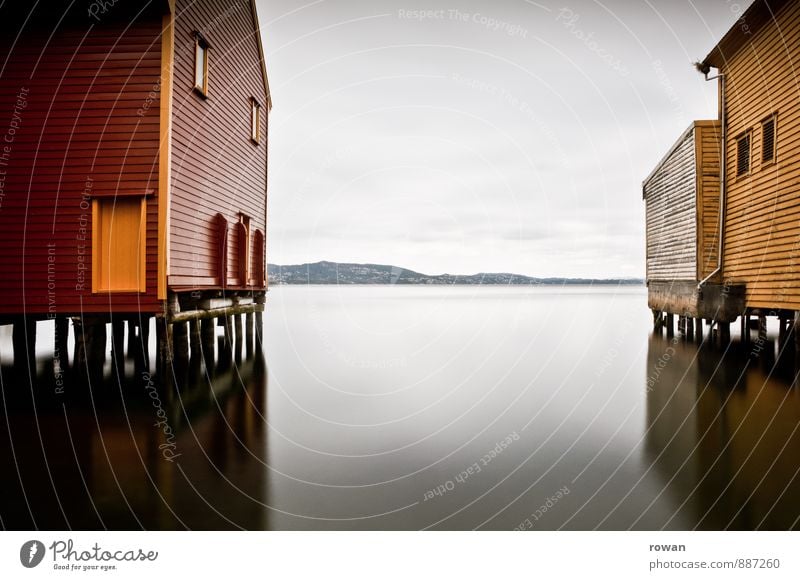 stand Coast Ocean Lake House (Residential Structure) Manmade structures Building Architecture Smoothness Reflection Wooden house Boathouse Bergen Red Yellow