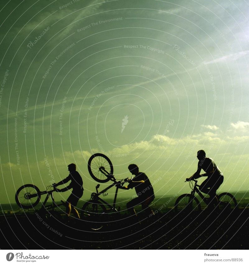 playing boys Cycling Bicycle Man Masculine Motorcyclist Romp Clouds Green Playing Exterior shot Happiness Exuberance Joy Group Sports willing Landscape Sky Men