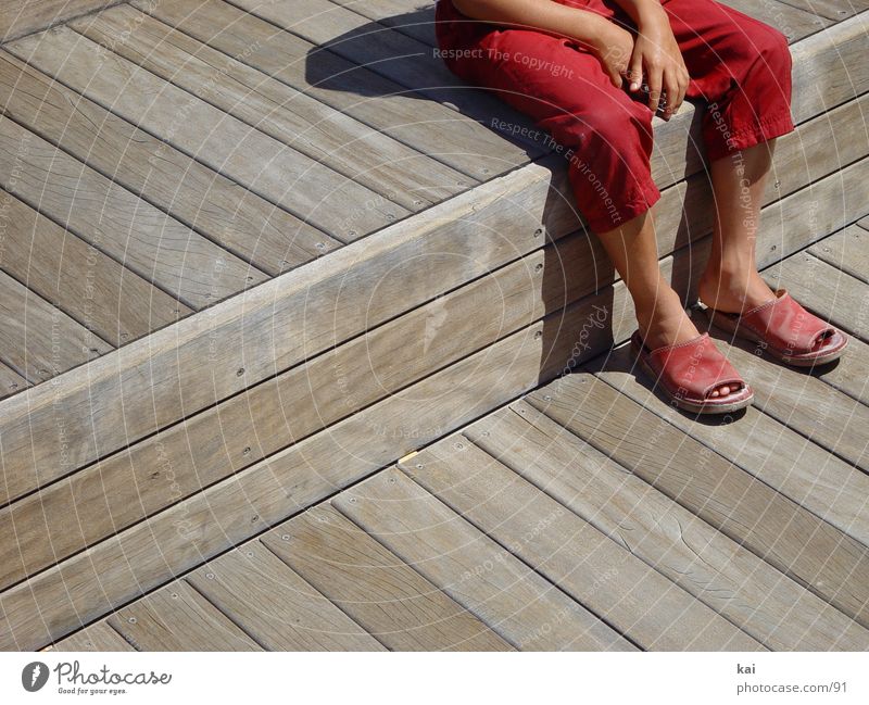rest Girl Break Pants Red Hand Photographic technology Sit Feet Sandal Section of image Exterior shot Wait