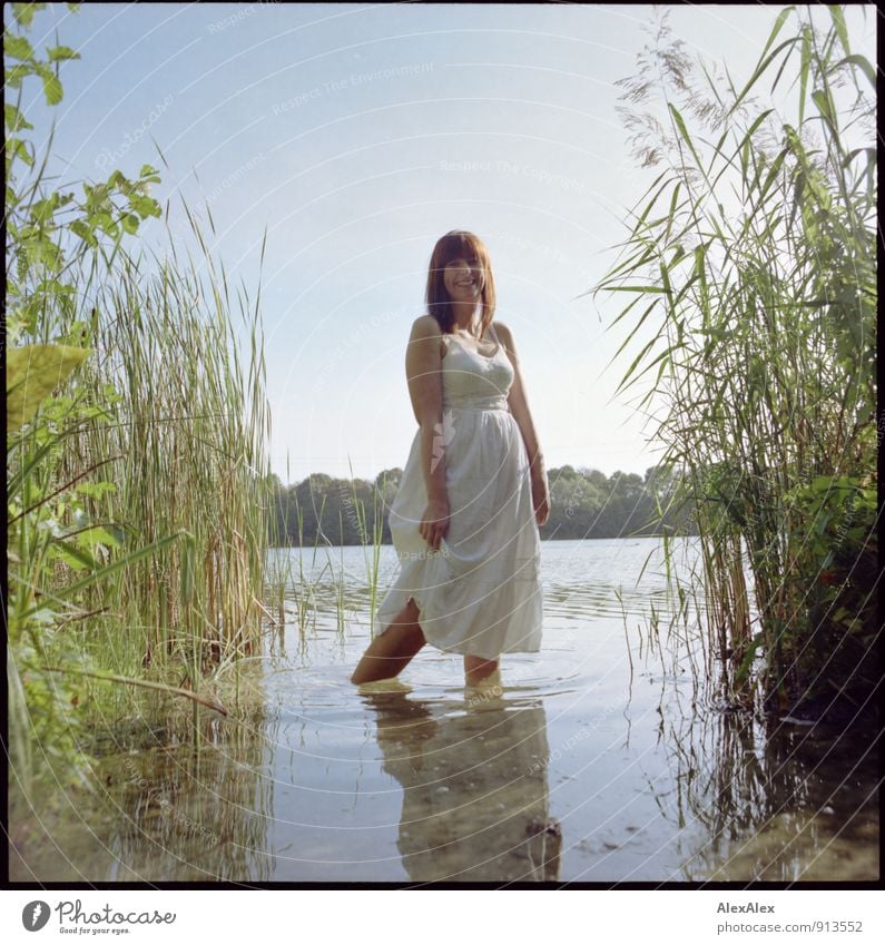 Catch frogs Trip Adventure Summer vacation Young woman Youth (Young adults) 18 - 30 years Adults Beautiful weather Common Reed Lakeside Dress Barefoot Smiling
