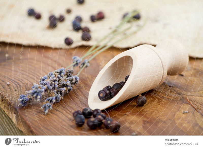 juniper berries and lavender Kiddy shovel Juniper Berries Wooden spoon Lavender Dried spice spoon Linen Wooden floor Spoon cooking ingredients Herbs and spices