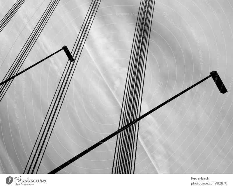 Lines against a turbulent background Black & white photo Exterior shot Pattern Structures and shapes Deserted Lamp Cable Sky Clouds Weather Rain Bridge