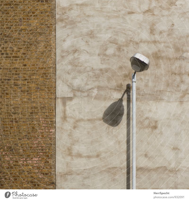 shadow thrower London England Old town Manmade structures Building Wall (barrier) Wall (building) Facade Brick Brown Shadow play Street lighting Lamp post
