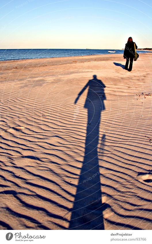 What was left of the day... Ocean Beach Man Woman Stalking Black Coat Pants Sculpture Emotions Shadow Chase Beach dune Blue Sky Contrast Baltic Sea Line