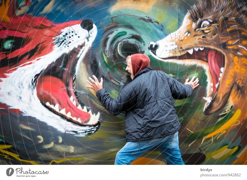 A man feels attacked by wild animals painted on a wall. Symbol image, nightmare Fear of death psyche Nightmare Stress burnout emotional distress Anxiety dreams