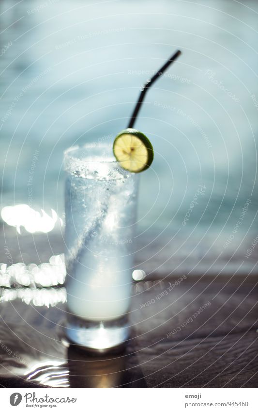 Fresh! Slices of lime Beverage Cold drink Drinking water Glass Straw Blue Water Wet Refrigeration Summer Colour photo Exterior shot Close-up Deserted Day