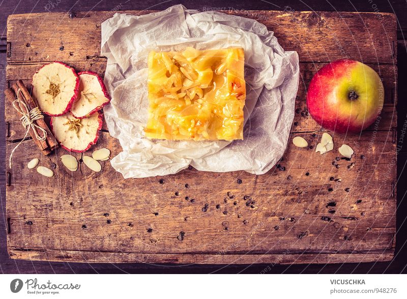 Piece of apple pie with cinnamon and almonds Food Fruit Apple Dough Baked goods Cake Dessert Nutrition Organic produce Vegetarian diet Diet Lifestyle