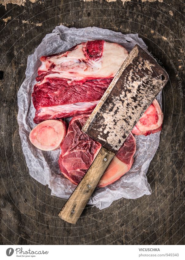 Raw soup meat with cleaver on dark background Food Meat Soup Stew Nutrition Knives Lifestyle Style Design Leisure and hobbies Wood Steel Skeleton Tafelspitz Axe