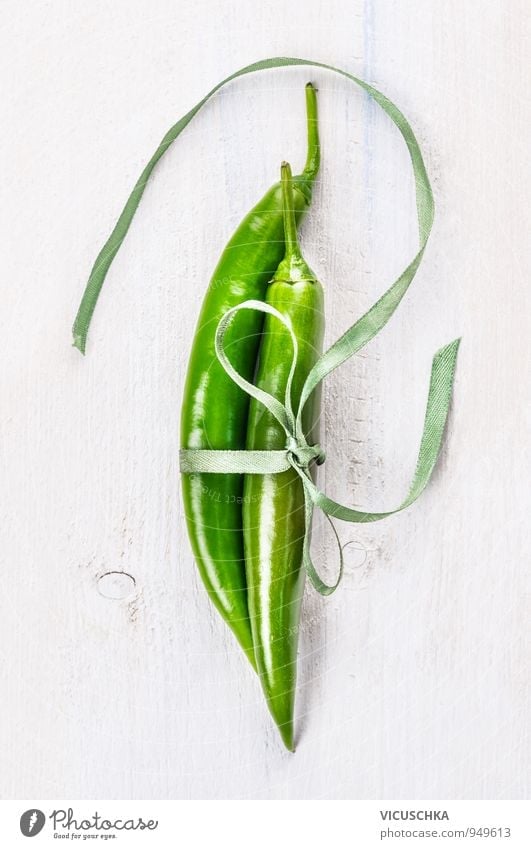 Two green chili peppers bound with ribbon Food Vegetable Herbs and spices Lifestyle Style Design Leisure and hobbies Nature Chili Background picture Tangy Fresh