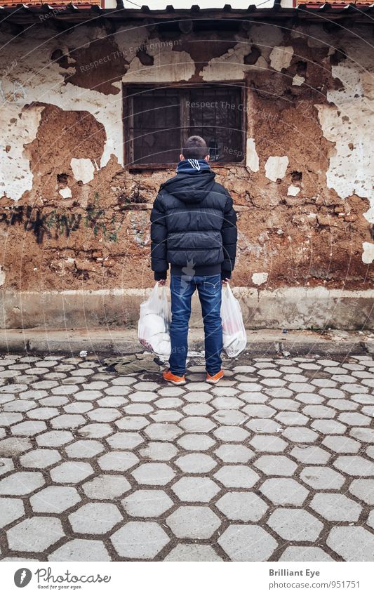 Boy with shopping bags in front of dilapidated house Shopping House (Residential Structure) Child Boy (child) 8 - 13 years Infancy Autumn Winter Jacket Old