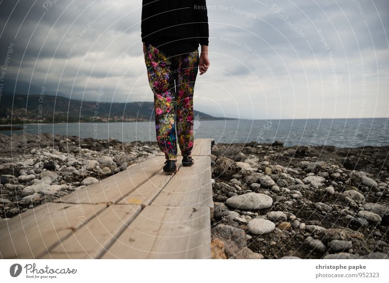 On the sea-path Feminine 1 Human being Clouds Bad weather Coast Beach Bay Ocean Lanes & trails Pants Relaxation Going Vacation & Travel Target Comfortless