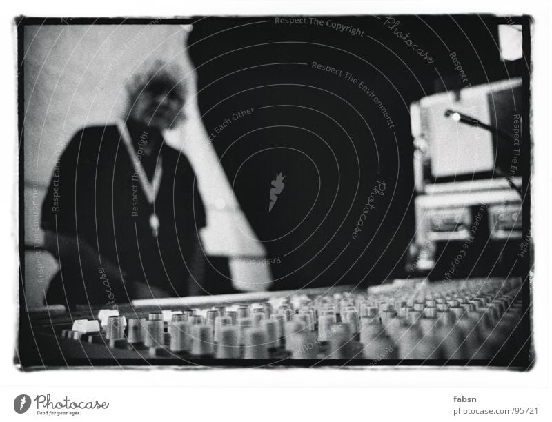 the technician Technician Mixing desk Live Lie Concert Outdoor festival Stage Buttons Electrical equipment Event Media Concentrate Black & white photo