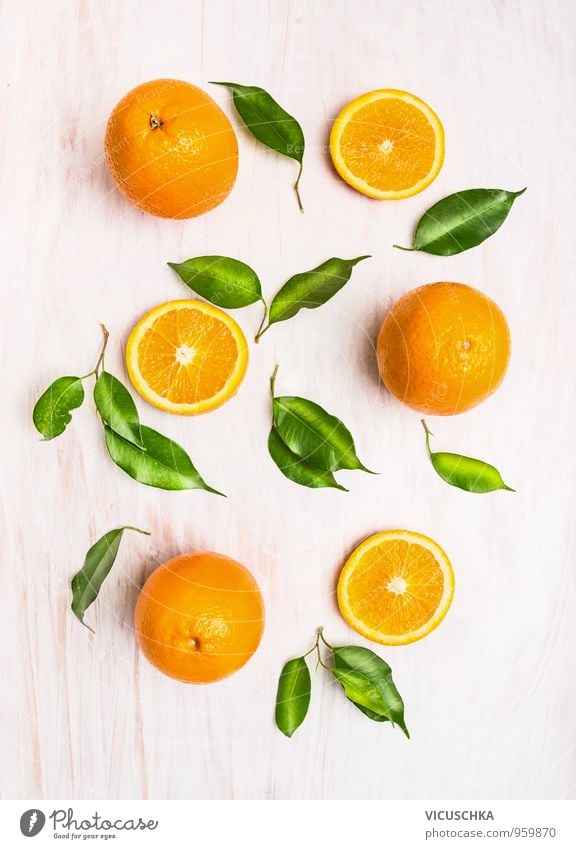 Orange fruits with green leaves on a white wooden background Food Fruit Nutrition Organic produce Vegetarian diet Diet Juice Healthy Eating Life Summer Winter