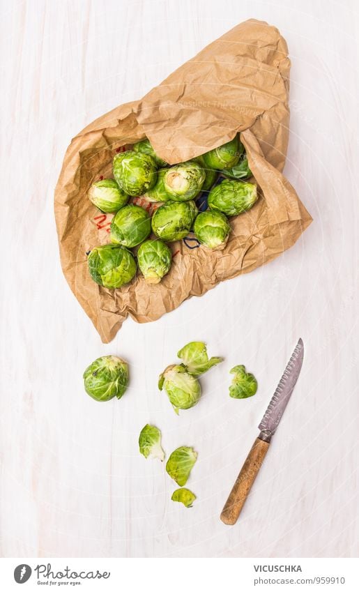 Brussels sprouts in paper bags on white wooden table Food Vegetable Nutrition Organic produce Vegetarian diet Diet Knives Style Winter Nature Design fresh