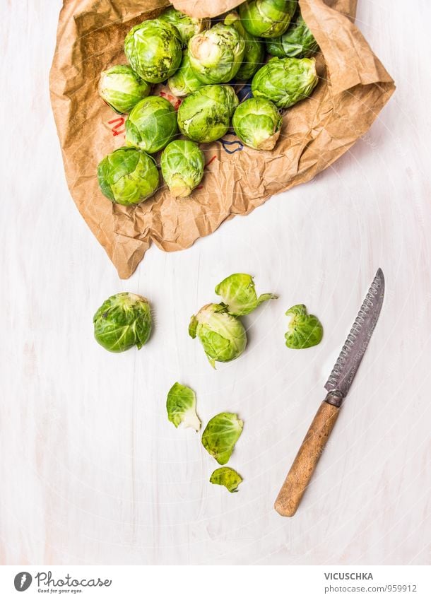 Prepare Brussels sprouts on a white wooden table Food Vegetable Nutrition Lunch Dinner Organic produce Vegetarian diet Diet Knives Style Design Healthy Eating