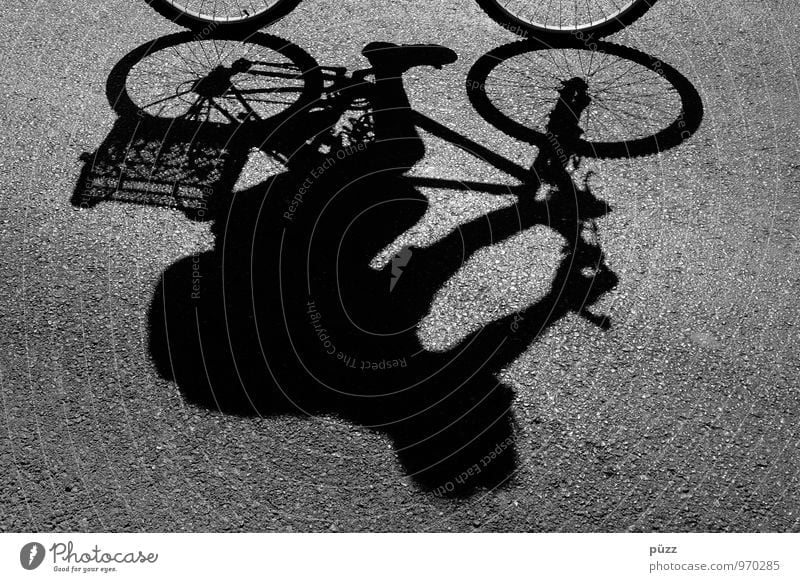 shadow-wheeler Cycling tour Bicycle 1 Human being Town Downtown Transport Means of transport Street Lanes & trails Movement Driving Healthy Athletic Gray Black