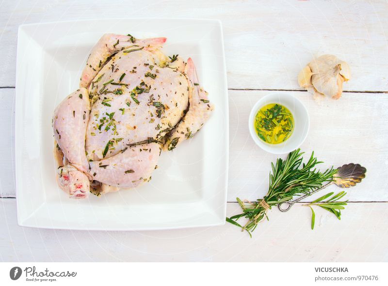whole chicken with oil, garlic and bunch rosemary Food Meat Herbs and spices Cooking oil Nutrition Dinner Organic produce Diet Bowl Spoon Lifestyle Design