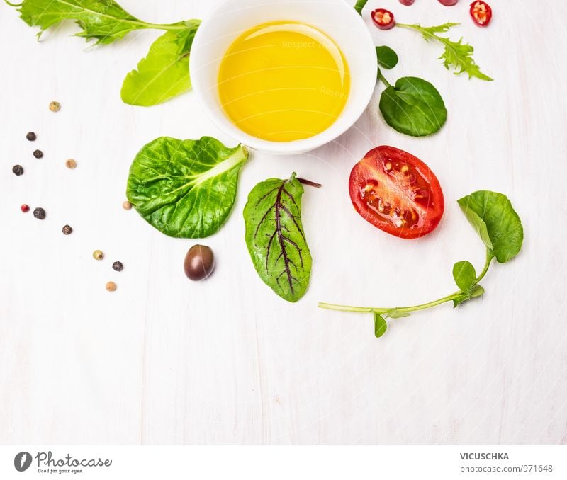 Salad leaves with dressing, olives and tomatoes Food Vegetable Lettuce Herbs and spices Cooking oil Nutrition Banquet Organic produce Vegetarian diet Diet Bowl