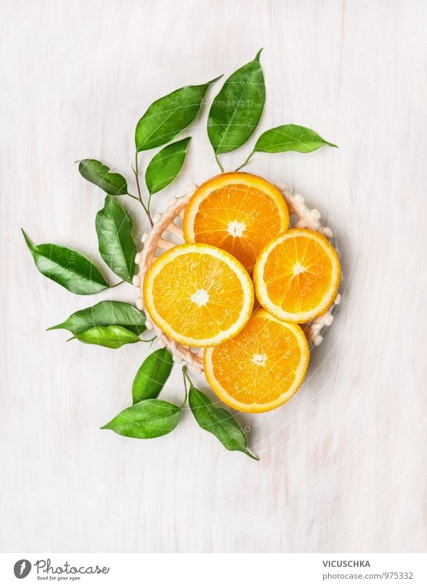 Cut oranges with green leaves Food Orange Dessert Nutrition Breakfast Buffet Brunch Juice Lifestyle Style Design Healthy Eating Summer Garden Nature Yellow