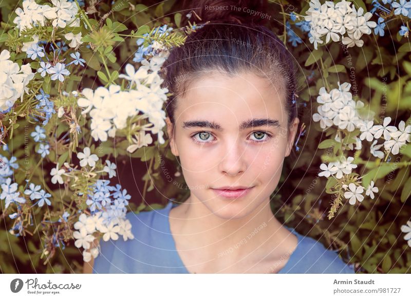 portrait of a beautiful girl between flowers Lifestyle Style Beautiful Contentment Relaxation Human being Feminine Youth (Young adults) Face 1 13 - 18 years