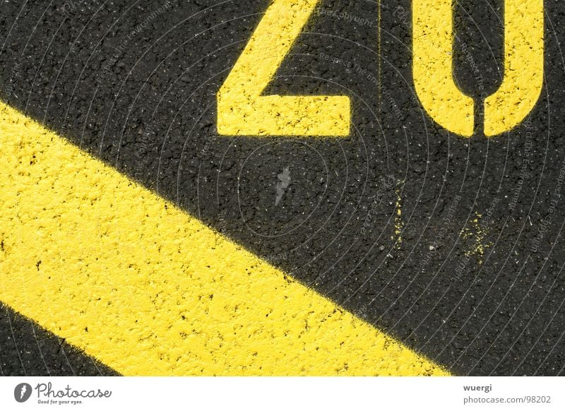 number 20 Yellow Black Parking lot Digits and numbers street lettering