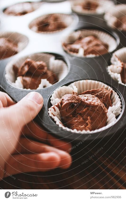 muffin maker Food Nutrition Fast food Bowl Human being Hand Fingers 1 Beautiful Muffin Baking tin Dough Chocolate cake Fresh Candy Delicious Appetite