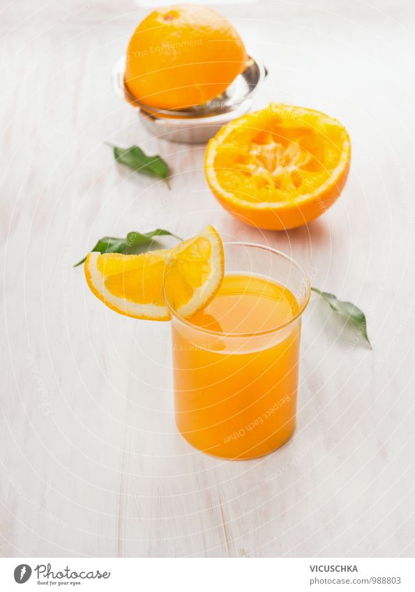 Glass with juice, pressed orange and citrus press Food Fruit Orange Beverage Juice Crockery Style Design Nature Yellow glass Orange juice Pressed Lemon squeezer